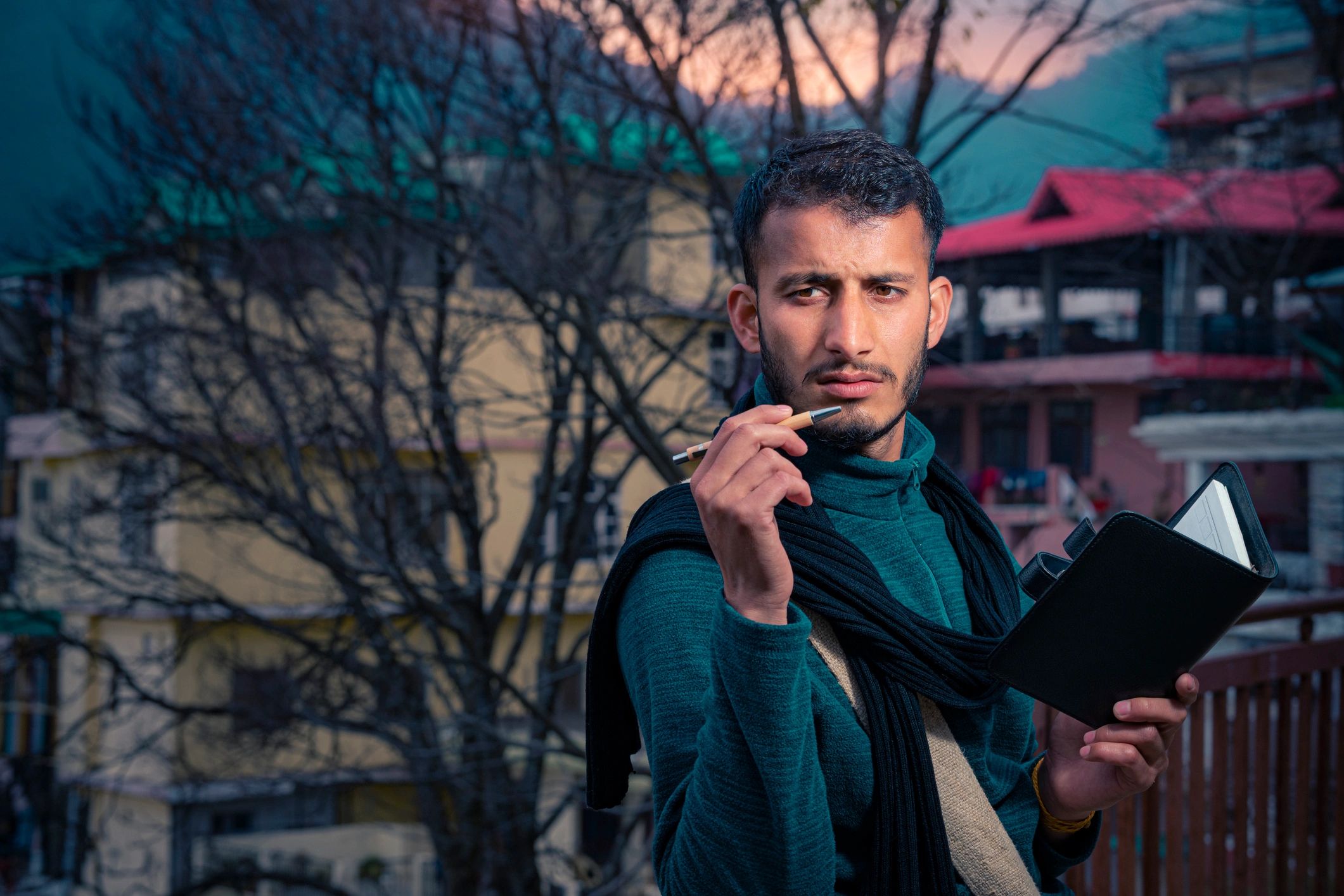 Journalist taking notes while reporting in India